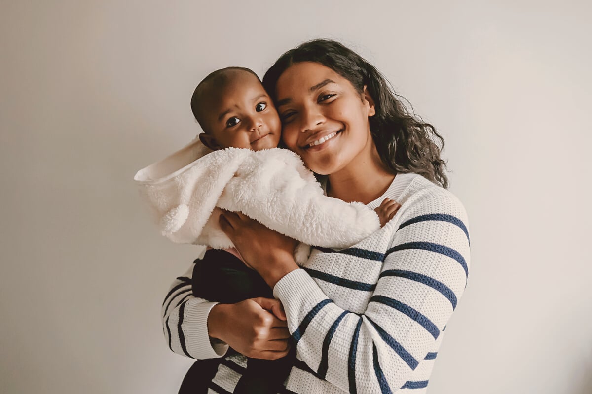 Smiling Mother and Baby Looking at Camera